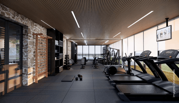 Academia com vista para a mata equipada com equipamentos profissionais